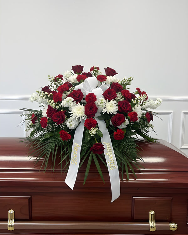 Red & White Casket Spray — a casket spray of red roses with white mums and stock, classic and heartfelt