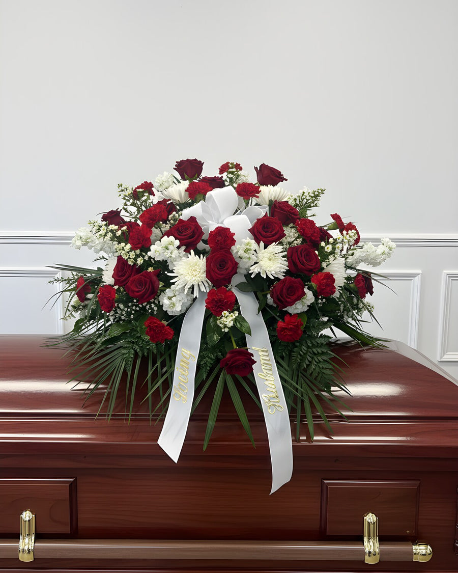 Red & White Casket Spray — a casket spray of red roses with white mums and stock, classic and heartfelt