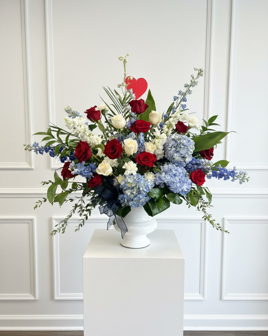 Patriot Urn — an urn arrangement of red, white, and blue blooms, a fitting tribute for a veteran or someone who served their country