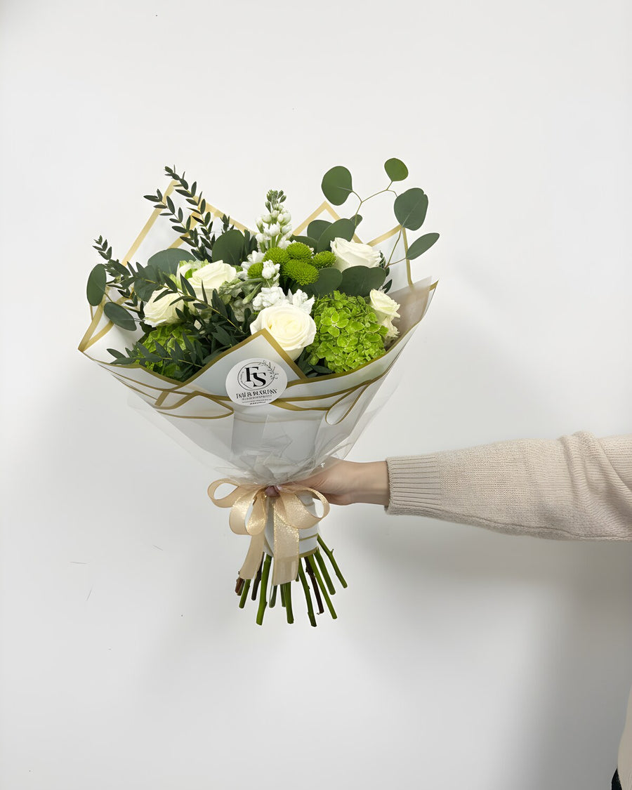 Green & White — a bouquet of crisp white roses, hydrangea, and lush green foliage