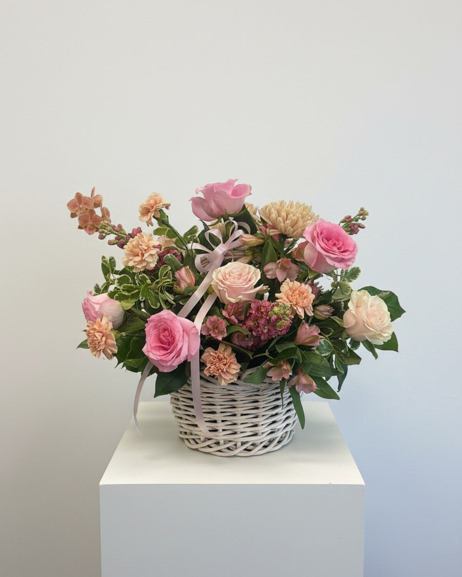 Garden Basket — a lush basket arrangement of mixed garden blooms and greenery, designed to look freshly cut from the garden