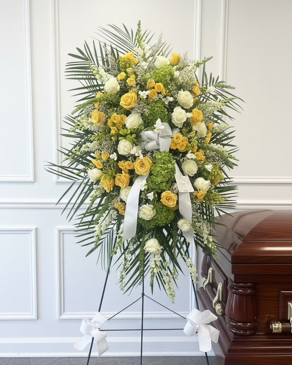 Sunlit Standing Spray — a standing spray of warm yellow and cream blooms, bright and comforting