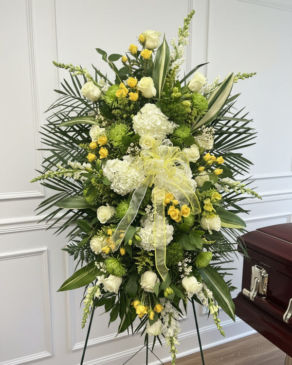 Golden Standing Spray — a standing spray of golden yellow roses, chrysanthemums, and lilies, accented with lush greenery