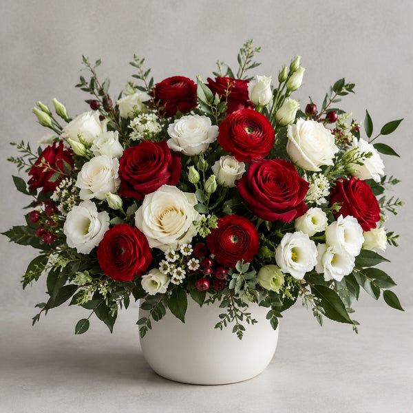 Designer's Choice - Red & White — florist's-choice arrangement in rich reds and crisp whites, shown in our ceramic vase