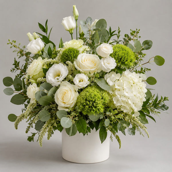 Designer's Choice - White & Green — florist's-choice arrangement in whites and creams with soft greens, shown in our ceramic vase