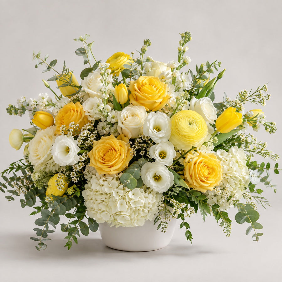 Designer's Choice — Yellows & Whites — florist's-choice arrangement in sunny yellows, creams and whites, shown in our ceramic vase